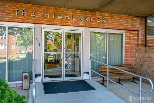 a outdoor living area with a table and chair