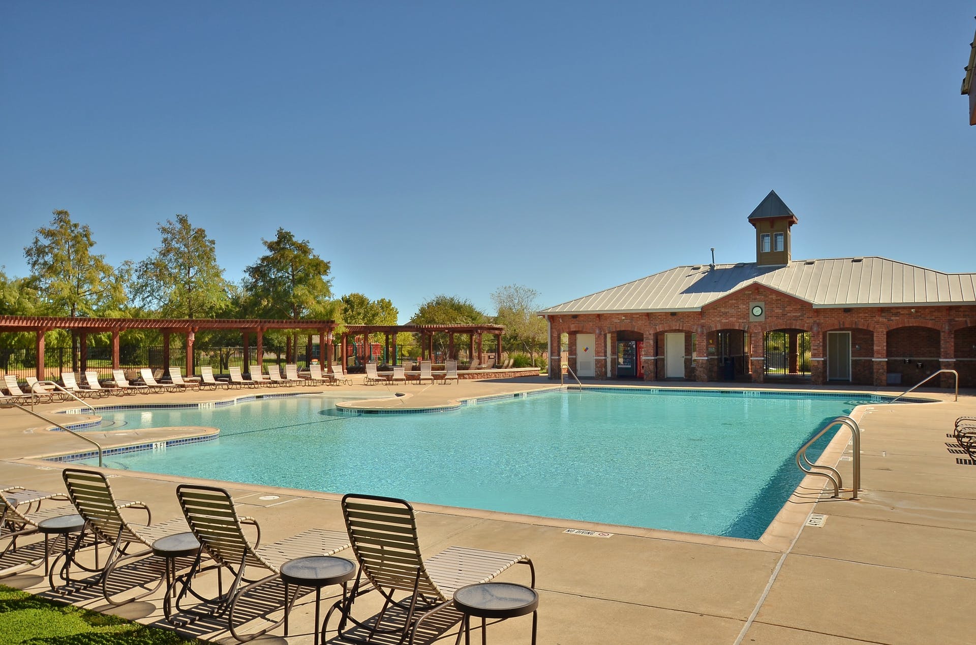 2004 Autumn Run Lane Round Rock, TX 78665 - Photo 36 of 37 Lounge poolside at the community's refreshing outdoor swimming pool and brick clubhouse, a perfect oasis.