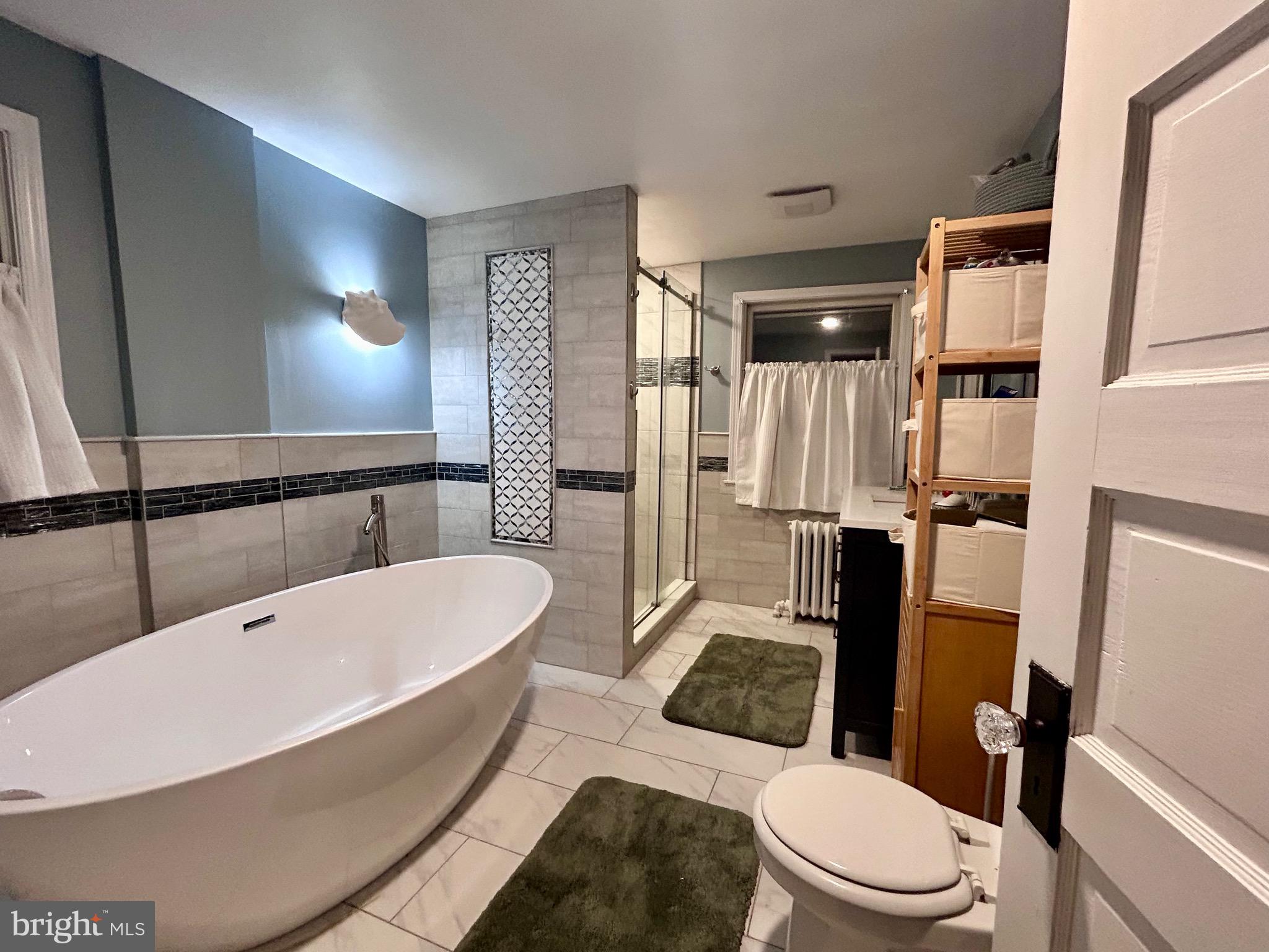 2415 Second Street Pike Newtown, PA 18940 - Photo 35 of 51 a bathroom with a sink a toilet a mirror and shower