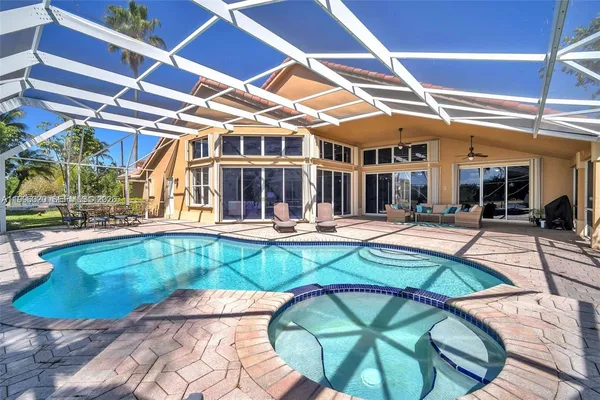 a view of a swimming pool with a patio