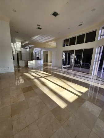 a view of a livingroom with furniture and staircase