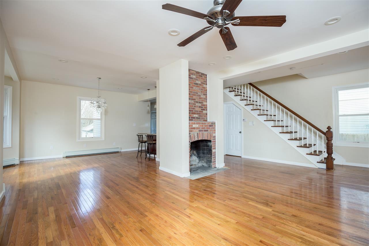 100 Knickerbocker Road Englewood, NJ 07631 - Photo 1 of 1 a view of an empty room with wooden floor and a window