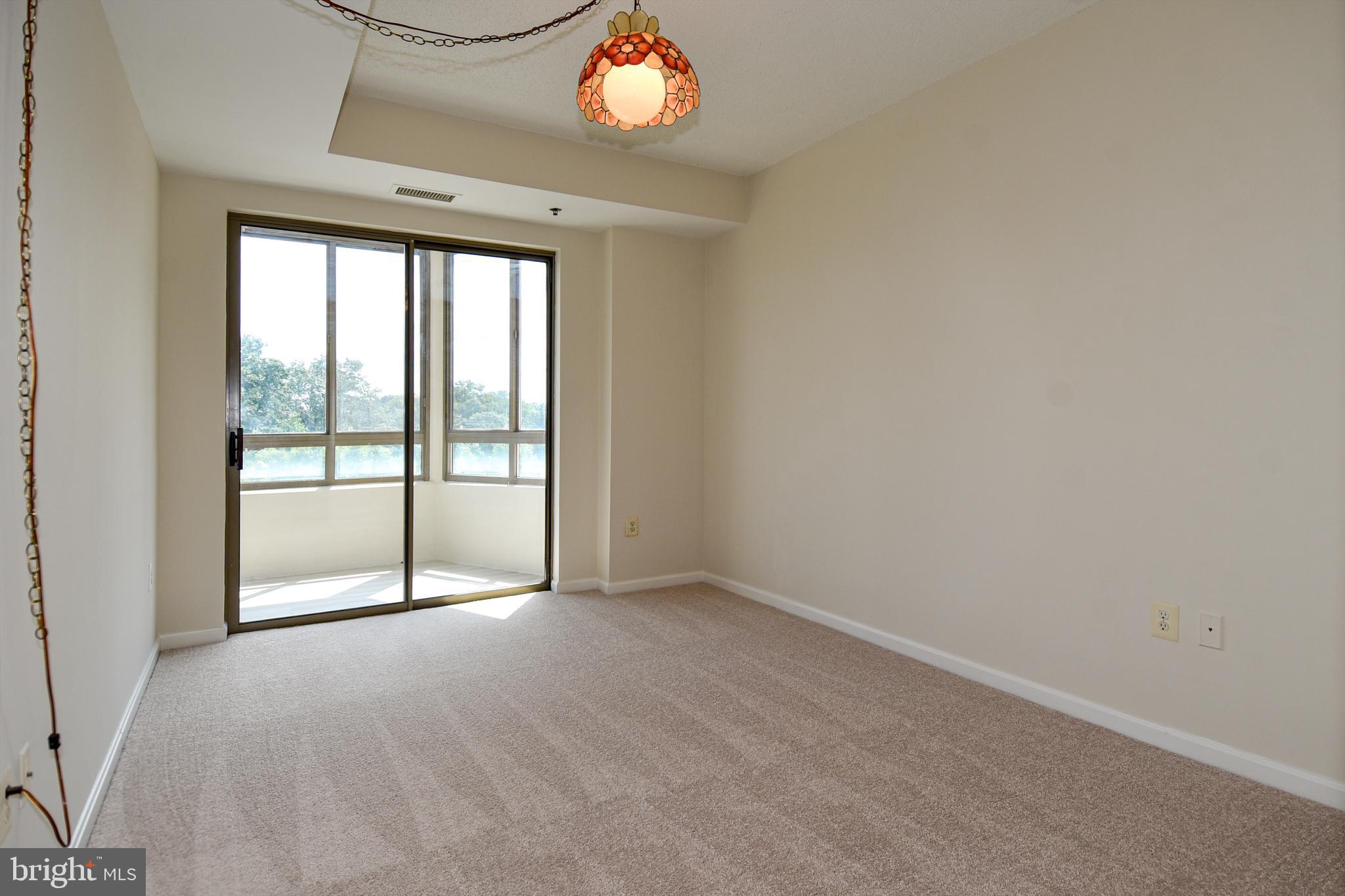 3200 North Leisure World Boulevard, Unit 407 Silver Spring, MD 20906 - Photo 21 of 38 Bedroom 2 access to balcony