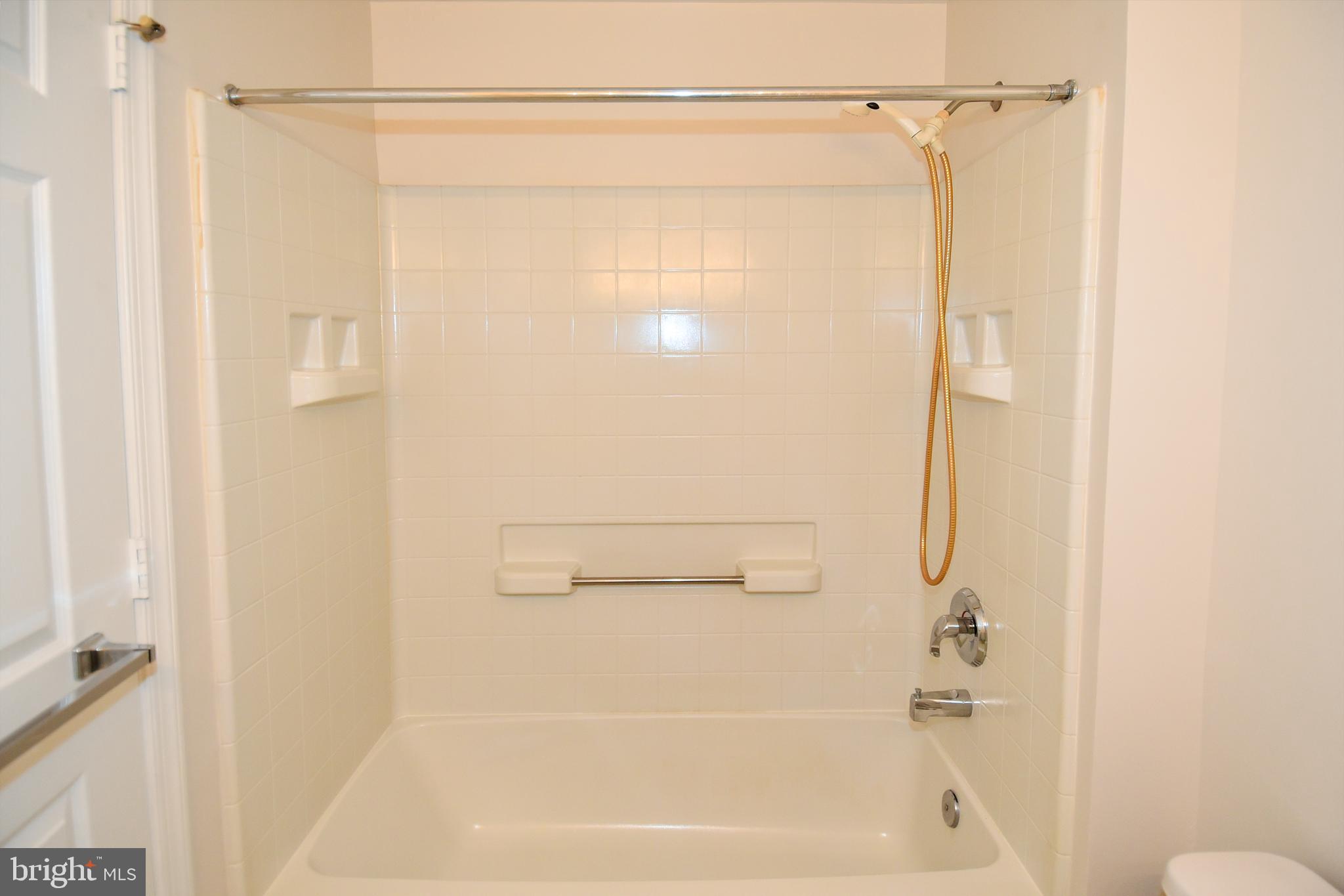 3200 North Leisure World Boulevard, Unit 407 Silver Spring, MD 20906 - Photo 26 of 38 Hall bath has tub shower