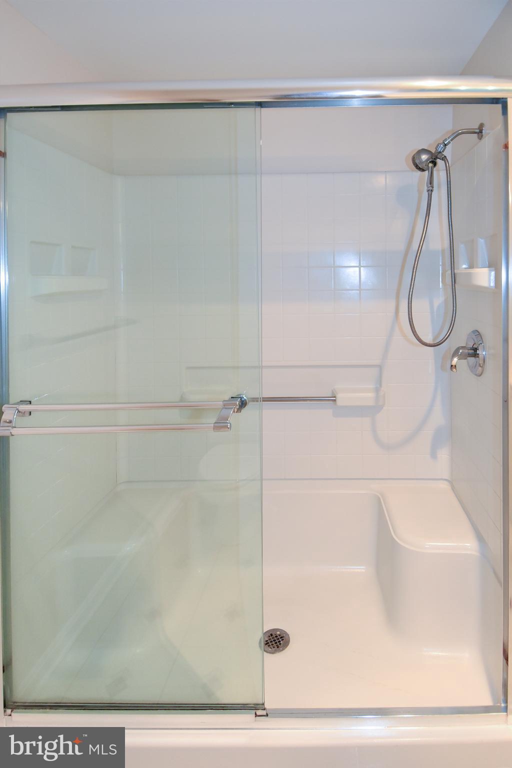3200 North Leisure World Boulevard, Unit 407 Silver Spring, MD 20906 - Photo 31 of 38 Stall shower with seating