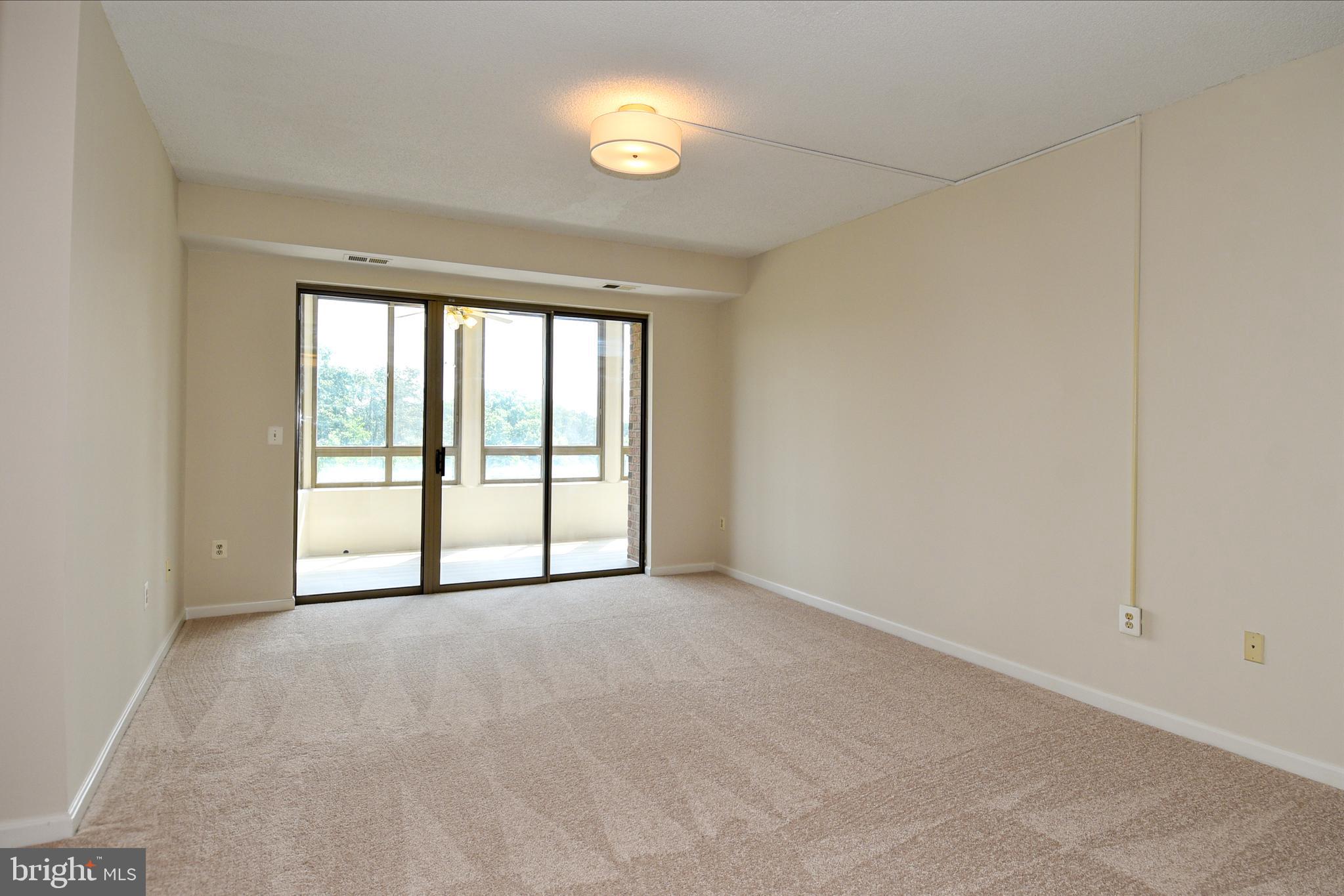 3200 North Leisure World Boulevard, Unit 407 Silver Spring, MD 20906 - Photo 8 of 38 Large well lit living room