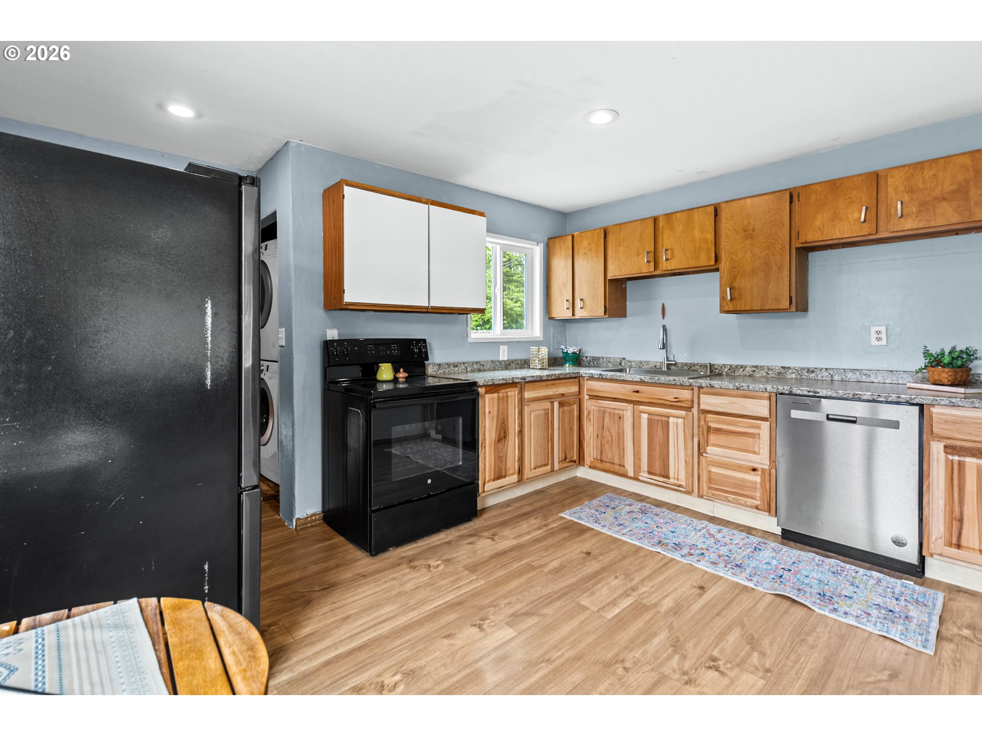 3009 Southwest Isaac Avenue Pendleton, OR 97801 - Photo 10 of 28 a kitchen with stainless steel appliances granite countertop a refrigerator and a stove top oven