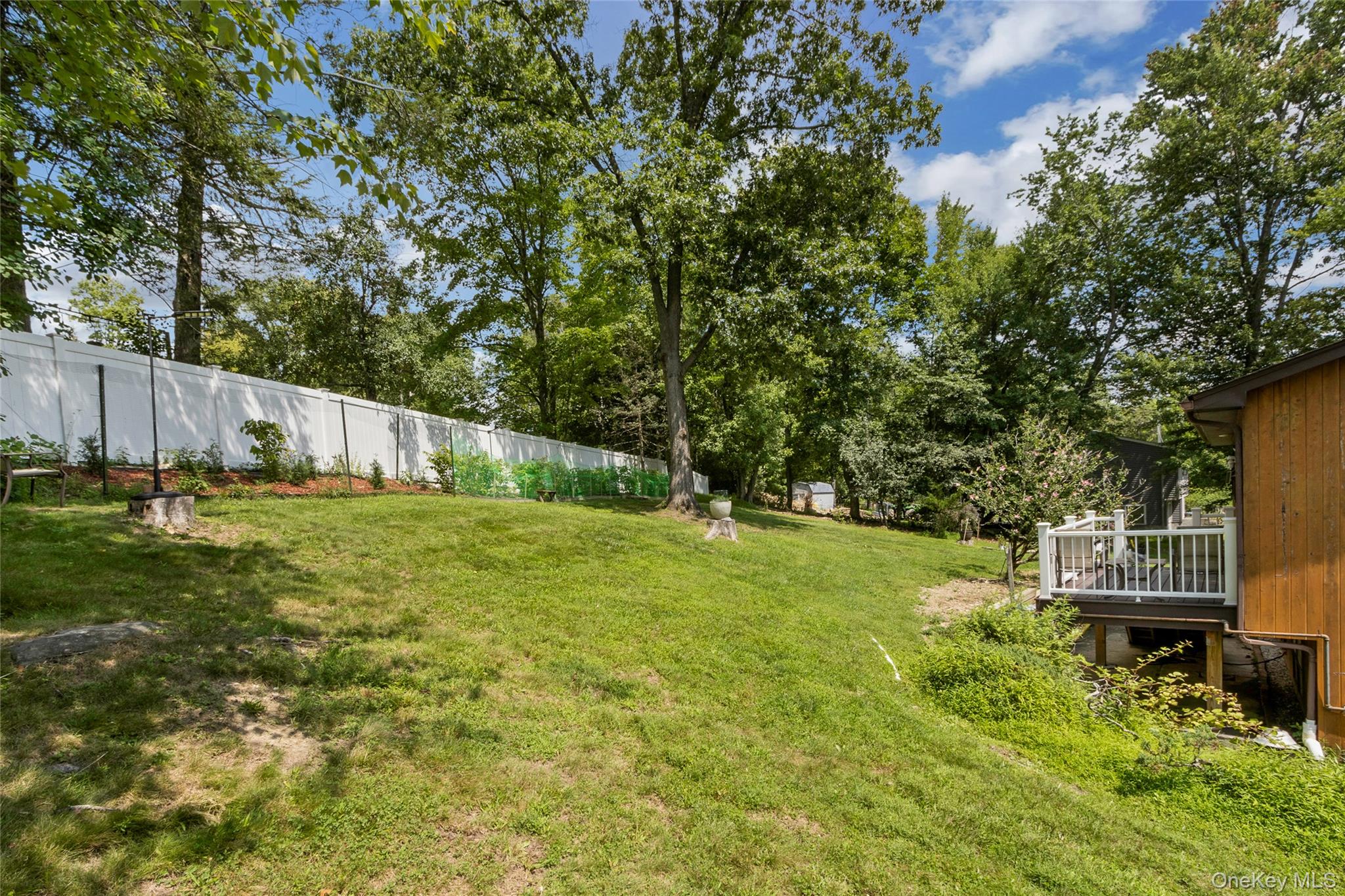 74 Heaton Road Monroe, NY 10950 - Photo 3 of 22 Rear of property showing fence, deck, and lots of room