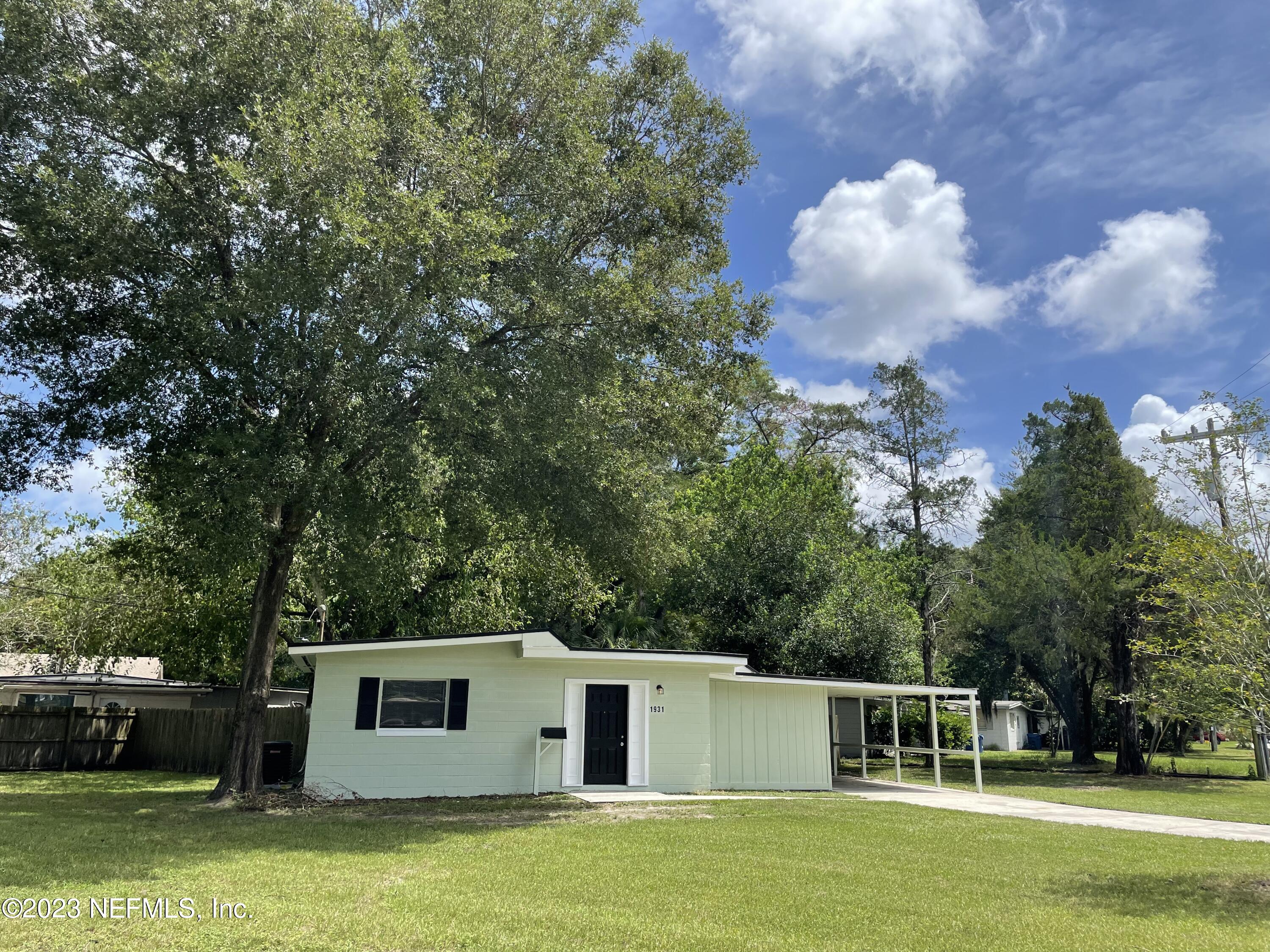 1931 Griflet Road Jacksonville, FL 32211 - Photo 2 of 29 a front view of a house with a garden