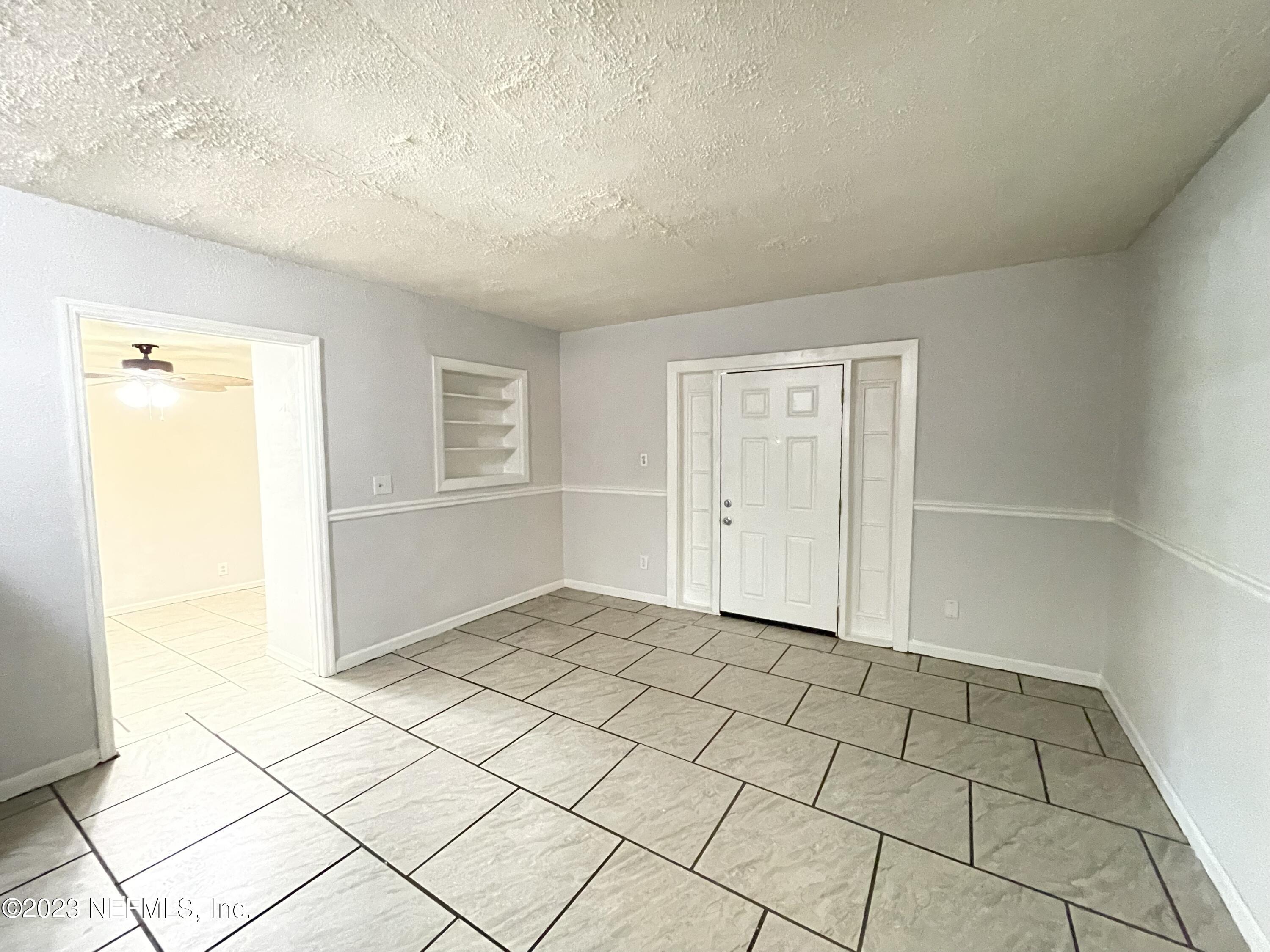 1931 Griflet Road Jacksonville, FL 32211 - Photo 4 of 29 a view of an empty room and window