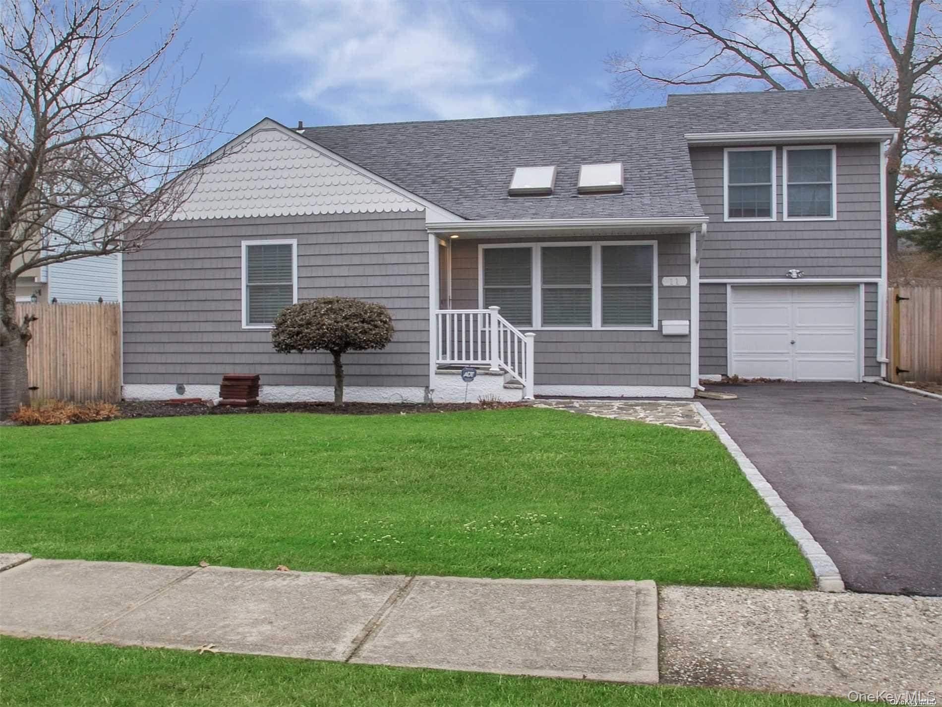11 Pratt Street West Babylon, NY 11704 - Photo 1 of 15 a front view of a house with a yard