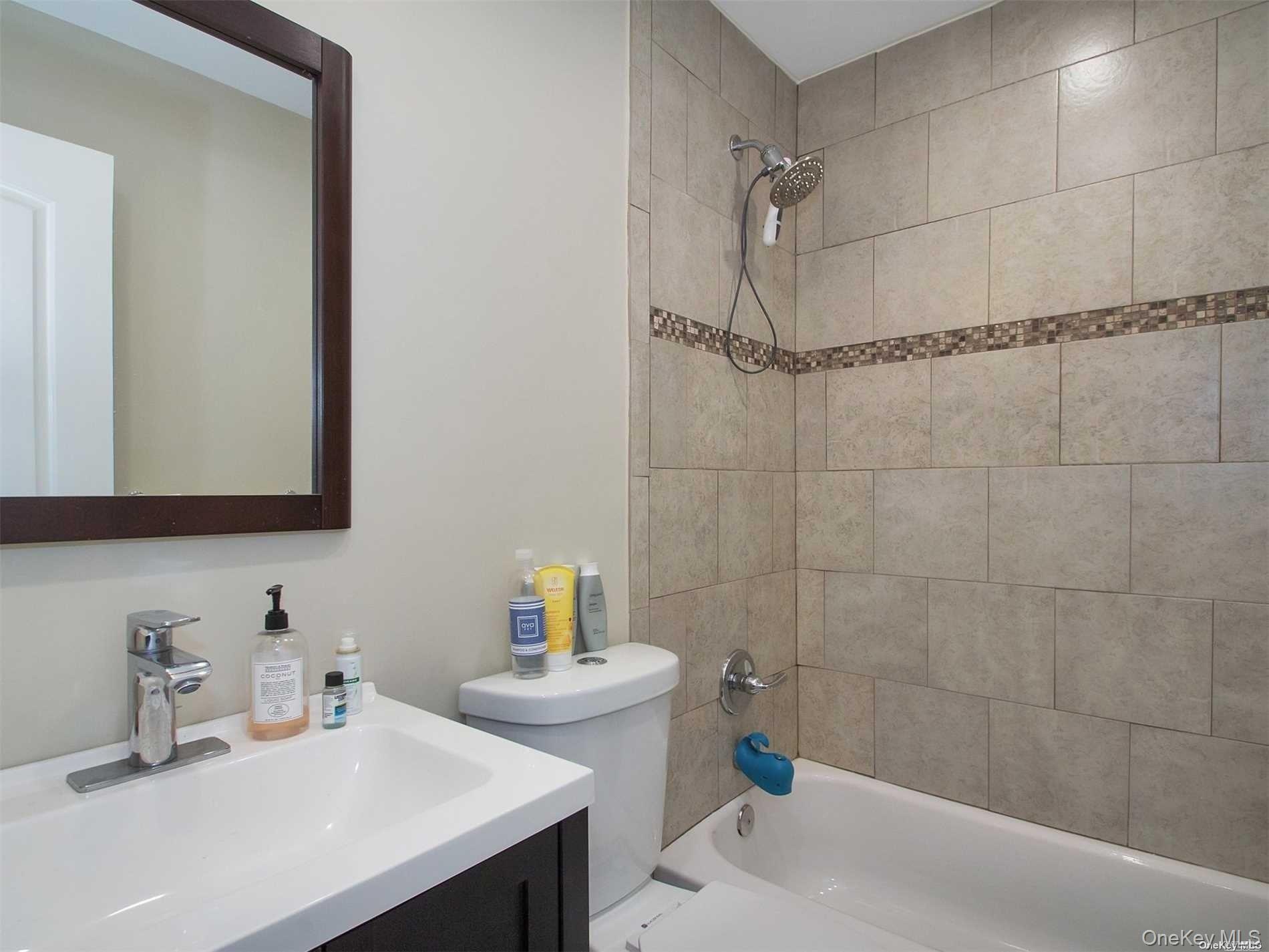 11 Pratt Street West Babylon, NY 11704 - Photo 12 of 15 a bathroom with a sink and a shower