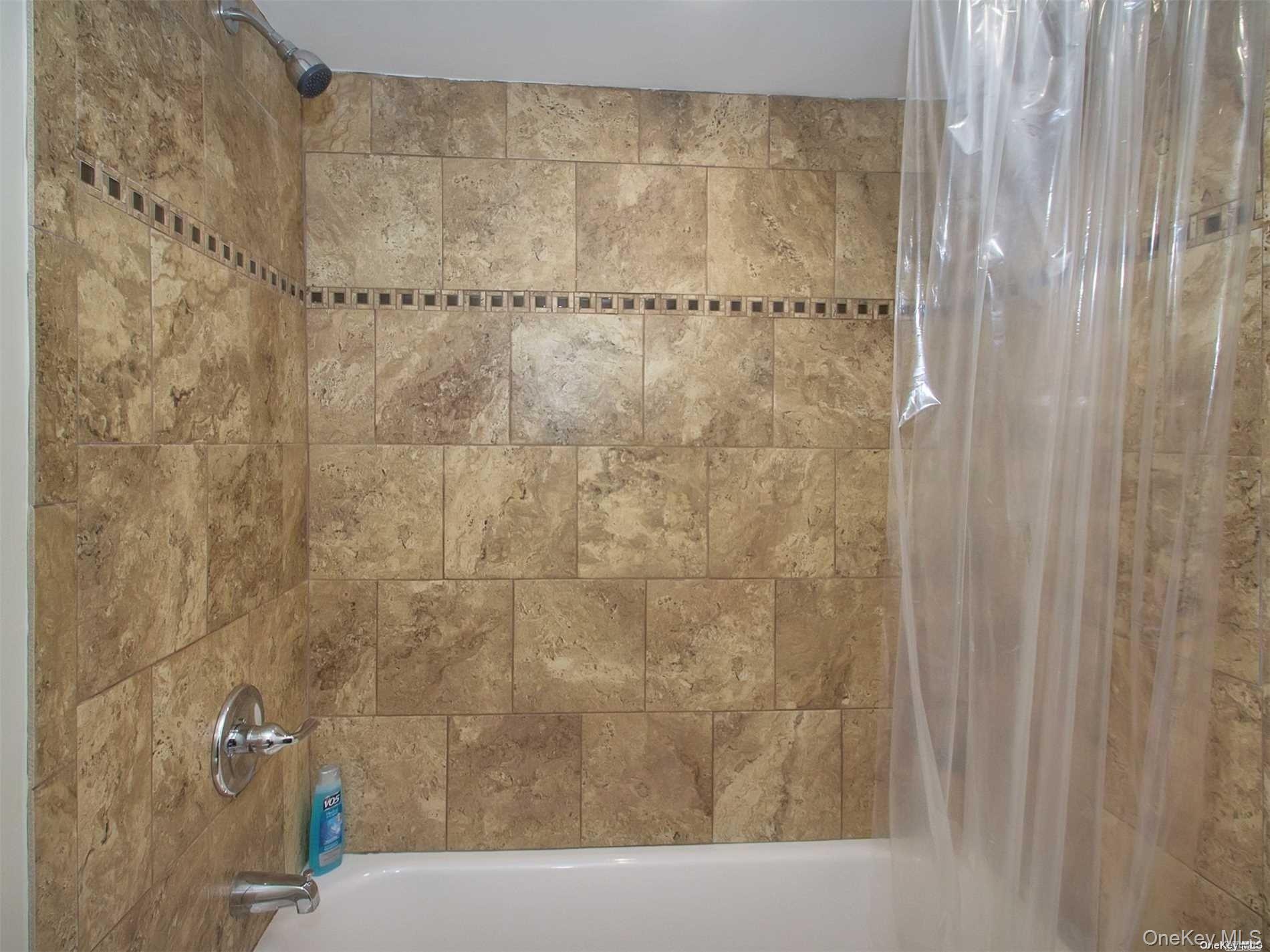 11 Pratt Street West Babylon, NY 11704 - Photo 13 of 15 a bathroom with a shower curtain