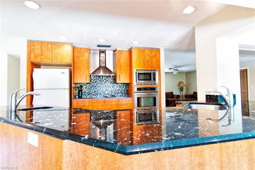 721 Springline Drive Naples, FL 34102 - Photo 4 of 7 a view of a living room with a large window