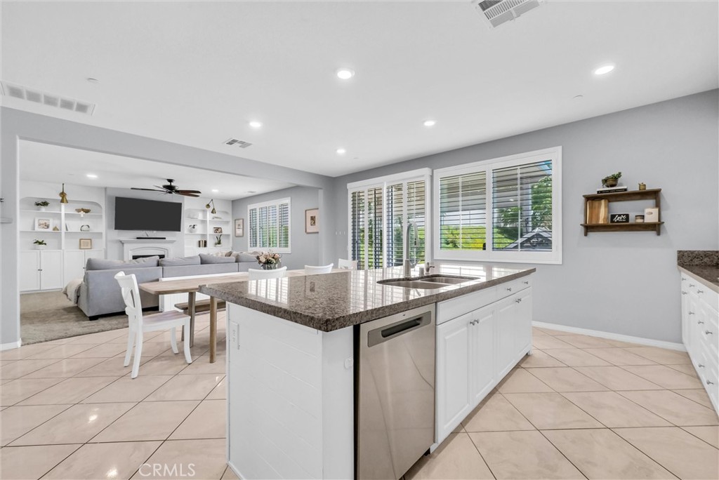 37656 Needlegrass Road Murrieta, CA 92563 - Photo 10 of 29 Stainless steel appliances compliment the bright kitchen.