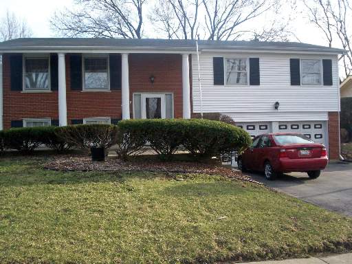 1059 Coach Road Homewood, IL 60430 - Photo 1 of 1 a view of a house with a yard garage and outdoor seating