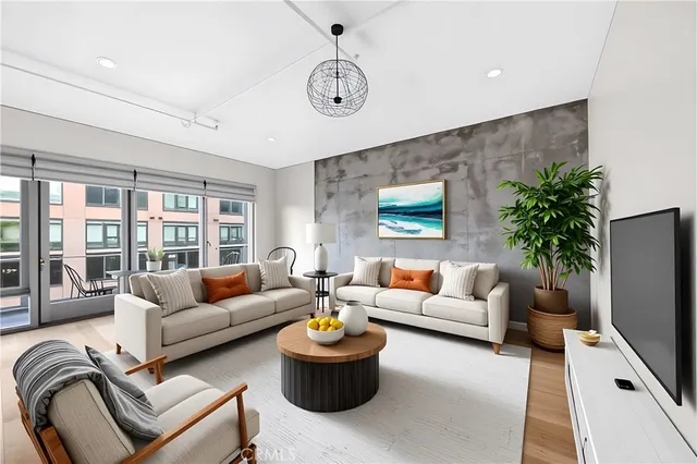 a living room with furniture and a flat screen tv