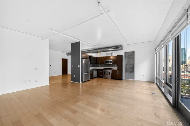 a view of a kitchen with a sink and an oven