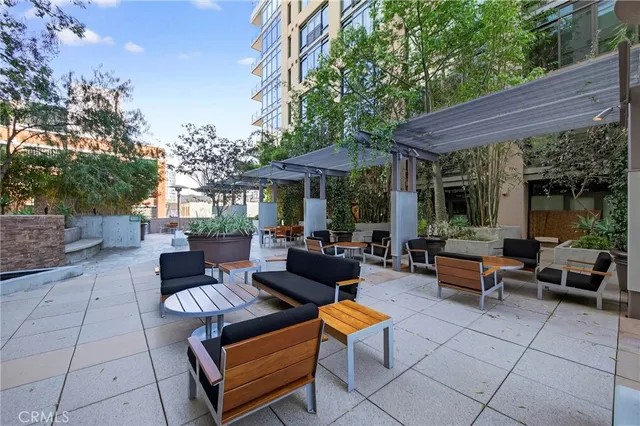 a view of a building with a large windows and plants