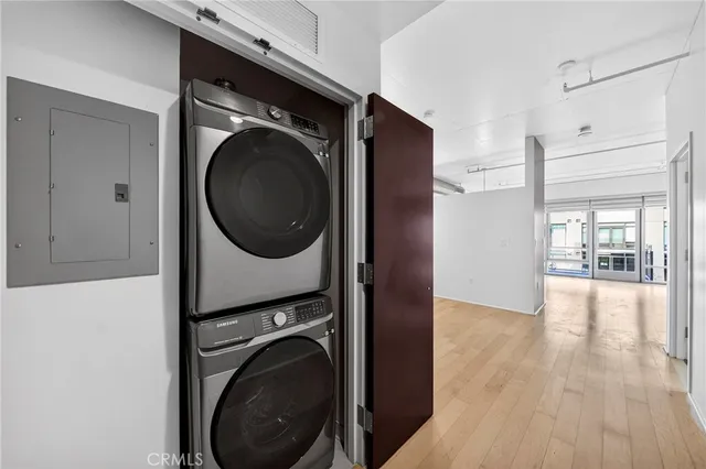 a view of a hallway with washer and dryer