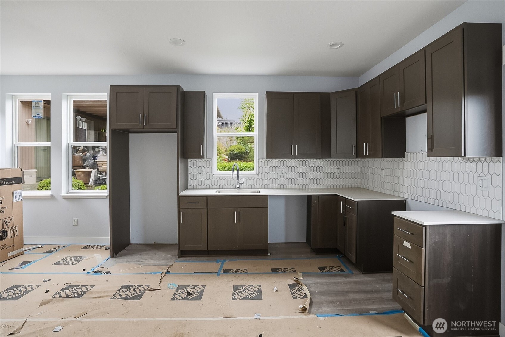 2317 22nd Avenue South Seattle, WA 98144 - Photo 14 of 29 a kitchen with a sink and cabinets