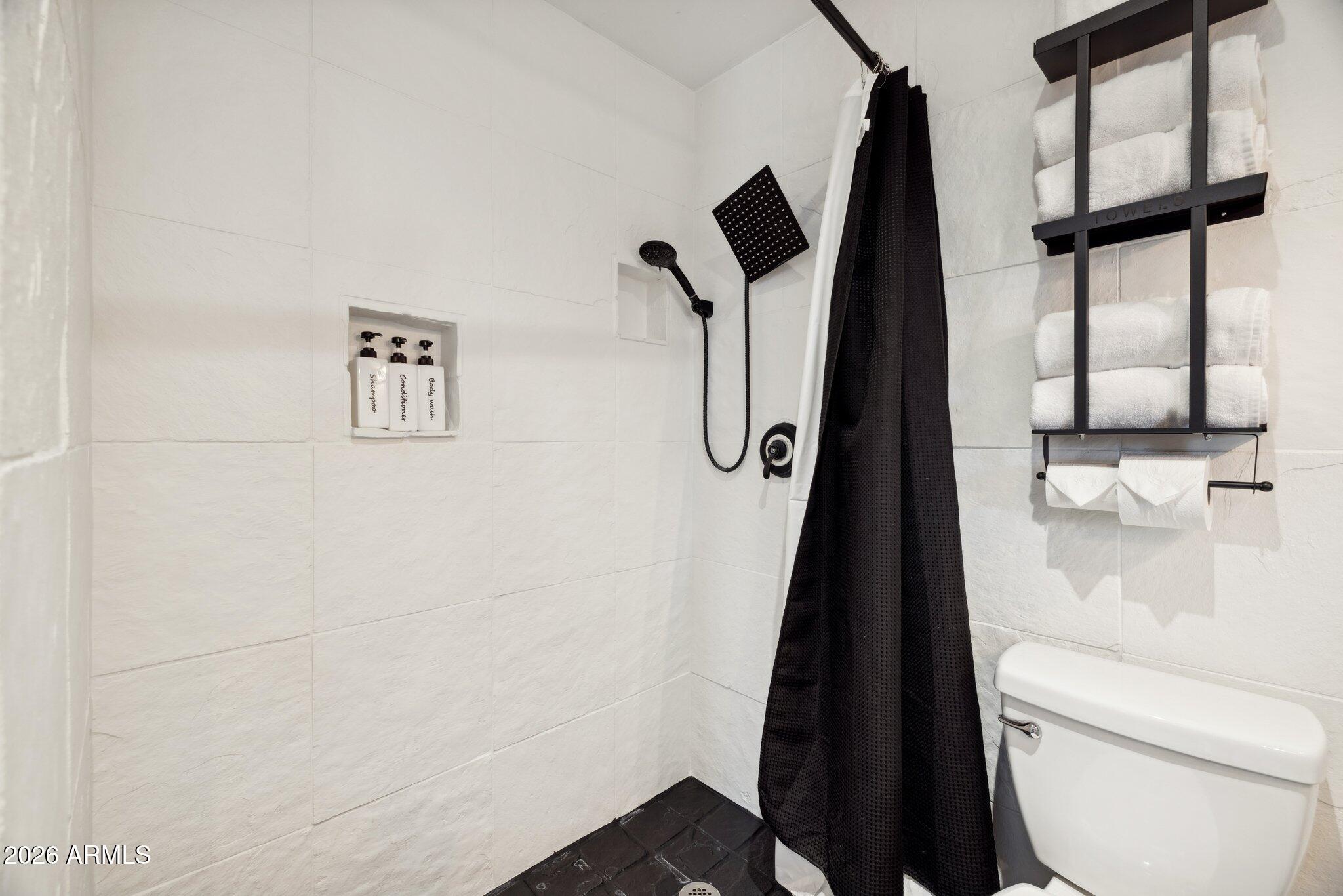 4723 South Country Club Way Tempe, AZ 85282 - Photo 21 of 46 a bathroom with a toilet and a shower