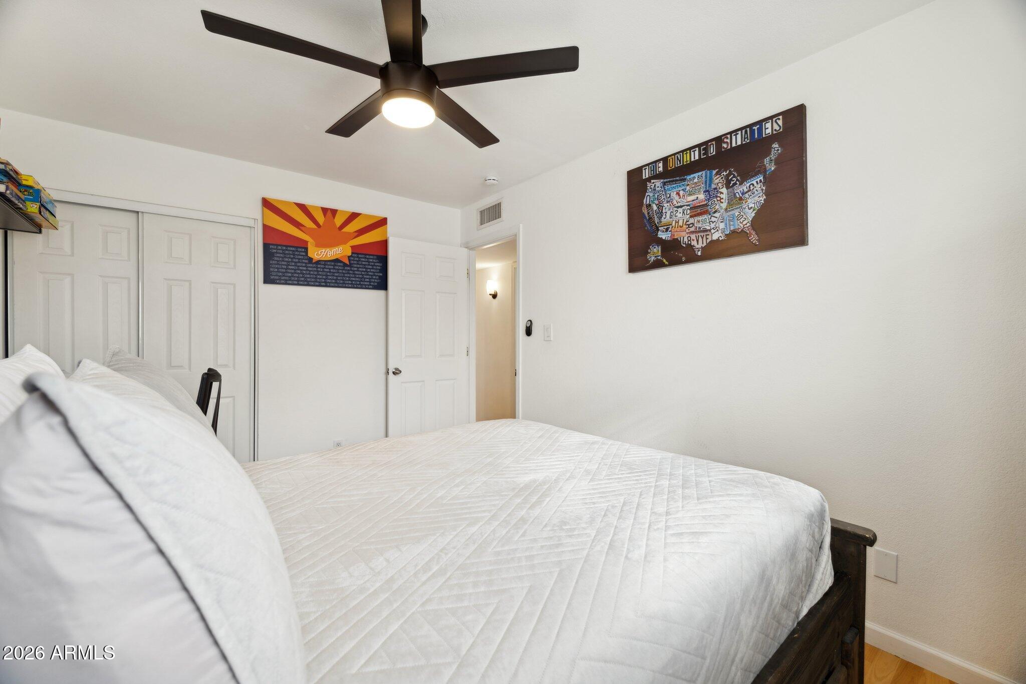 4723 South Country Club Way Tempe, AZ 85282 - Photo 23 of 46 a bedroom with a bed and a painting on the wall