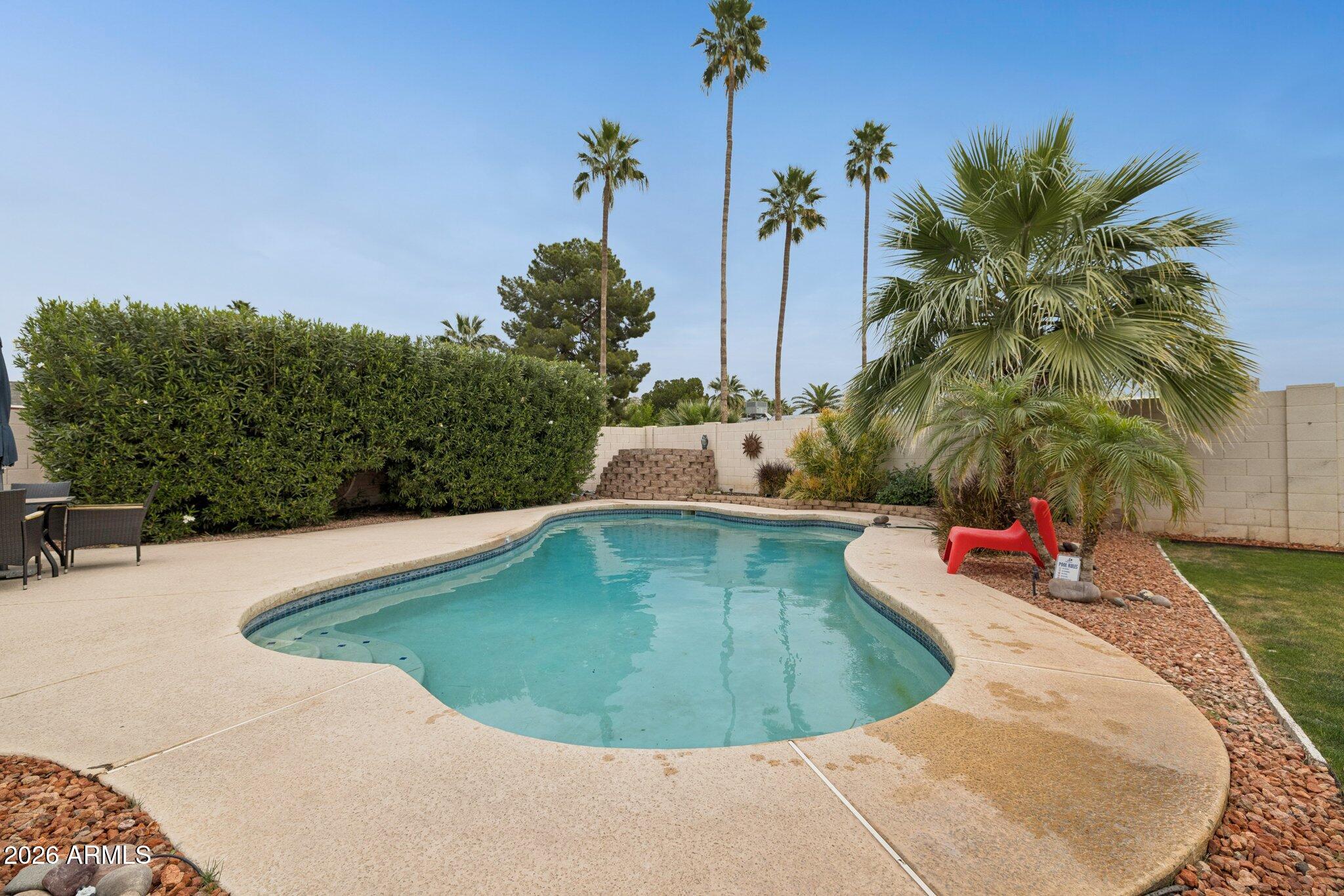 4723 South Country Club Way Tempe, AZ 85282 - Photo 31 of 46 a view of a swimming pool with a yard
