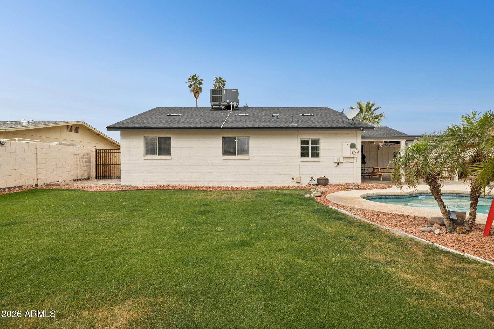 4723 South Country Club Way Tempe, AZ 85282 - Photo 32 of 46 a front view of a house with a garden