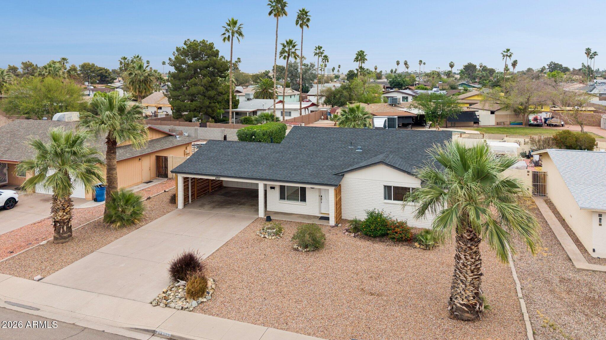 4723 South Country Club Way Tempe, AZ 85282 - Photo 35 of 46 a house with a garden in front of it