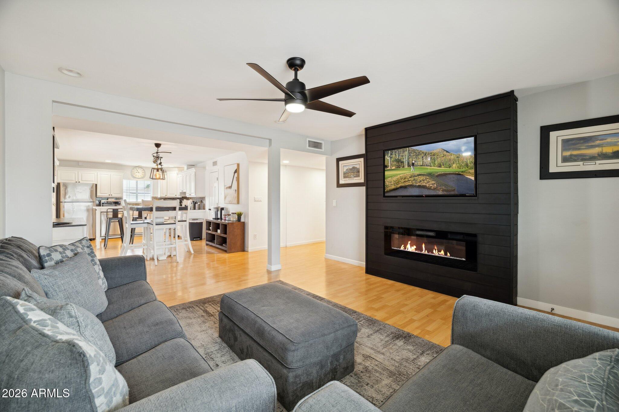 4723 South Country Club Way Tempe, AZ 85282 - Photo 5 of 46 a living room with furniture and a fireplace