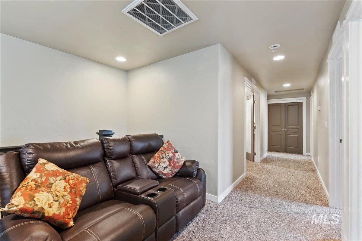 1011 West Riodosa Drive Meridian, ID 83642 - Photo 25 of 38 Living area with light colored carpet and recessed lighting