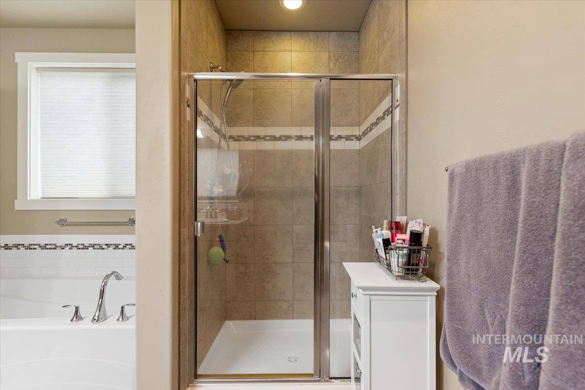 1011 West Riodosa Drive Meridian, ID 83642 - Photo 29 of 38 Bathroom with a bath and a stall shower