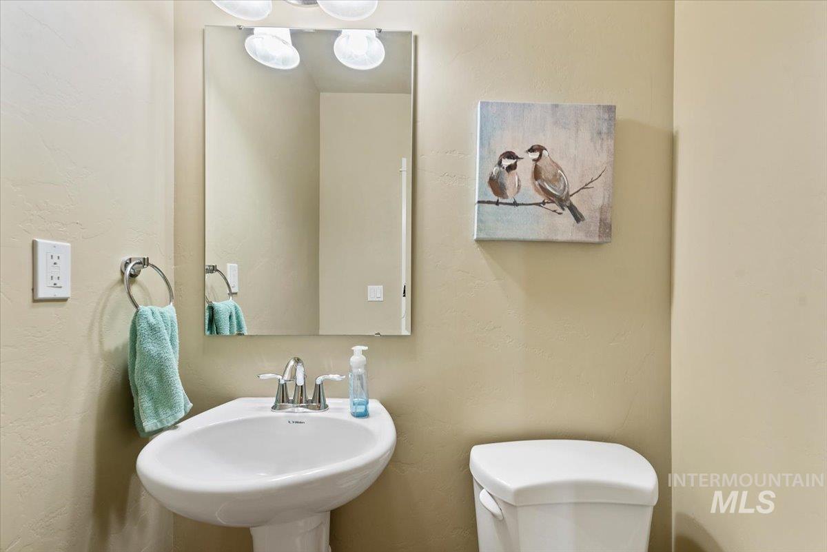 1011 West Riodosa Drive Meridian, ID 83642 - Photo 31 of 38 Half bath with toilet and a textured wall