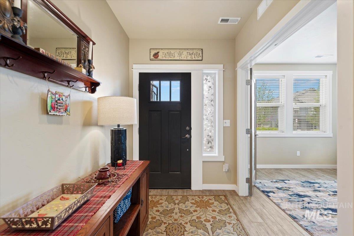 1011 West Riodosa Drive Meridian, ID 83642 - Photo 6 of 38 Foyer entrance with light wood finished floors and plenty of natural light