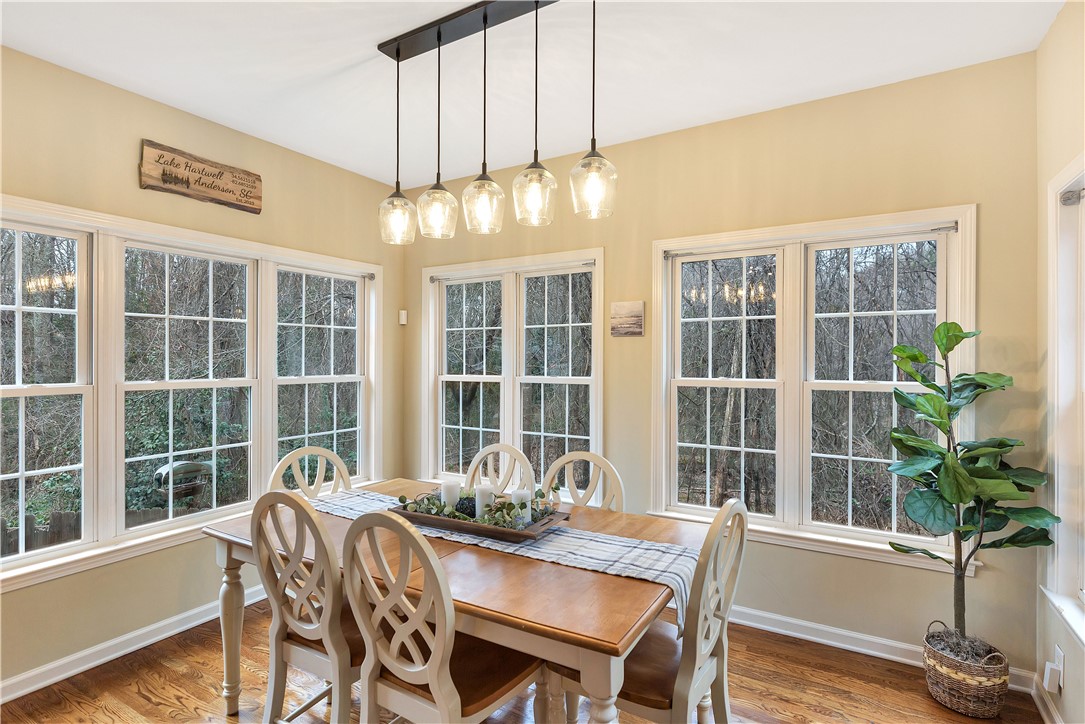 101 Riviera Circle Anderson, SC 29621 - Photo 11 of 35 This inviting dining area features rich hardwood flooring and abundant natural light from multiple windows.
