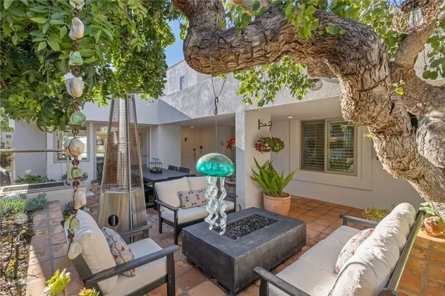 a bathroom with a granite countertop toilet sink and mirror