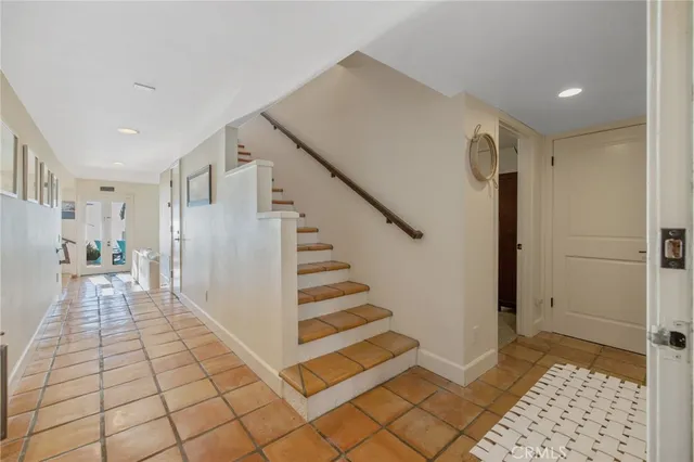 a spacious bedroom with a bed and a window