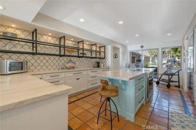 a bedroom with furniture and a large window