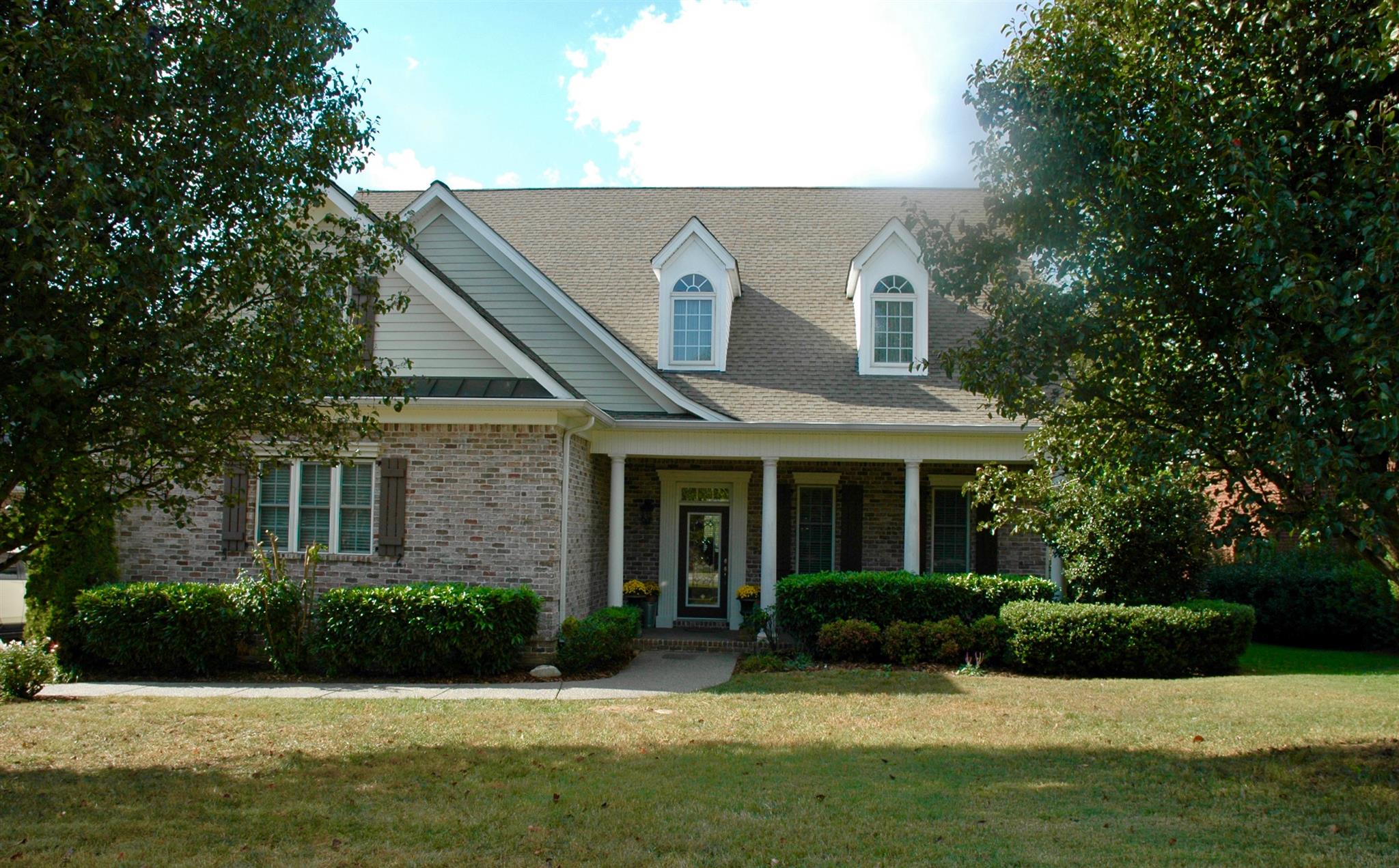 1604 Fair House Road Spring Hill, TN 37174 - Photo 1 of 18 a front view of a house with a yard