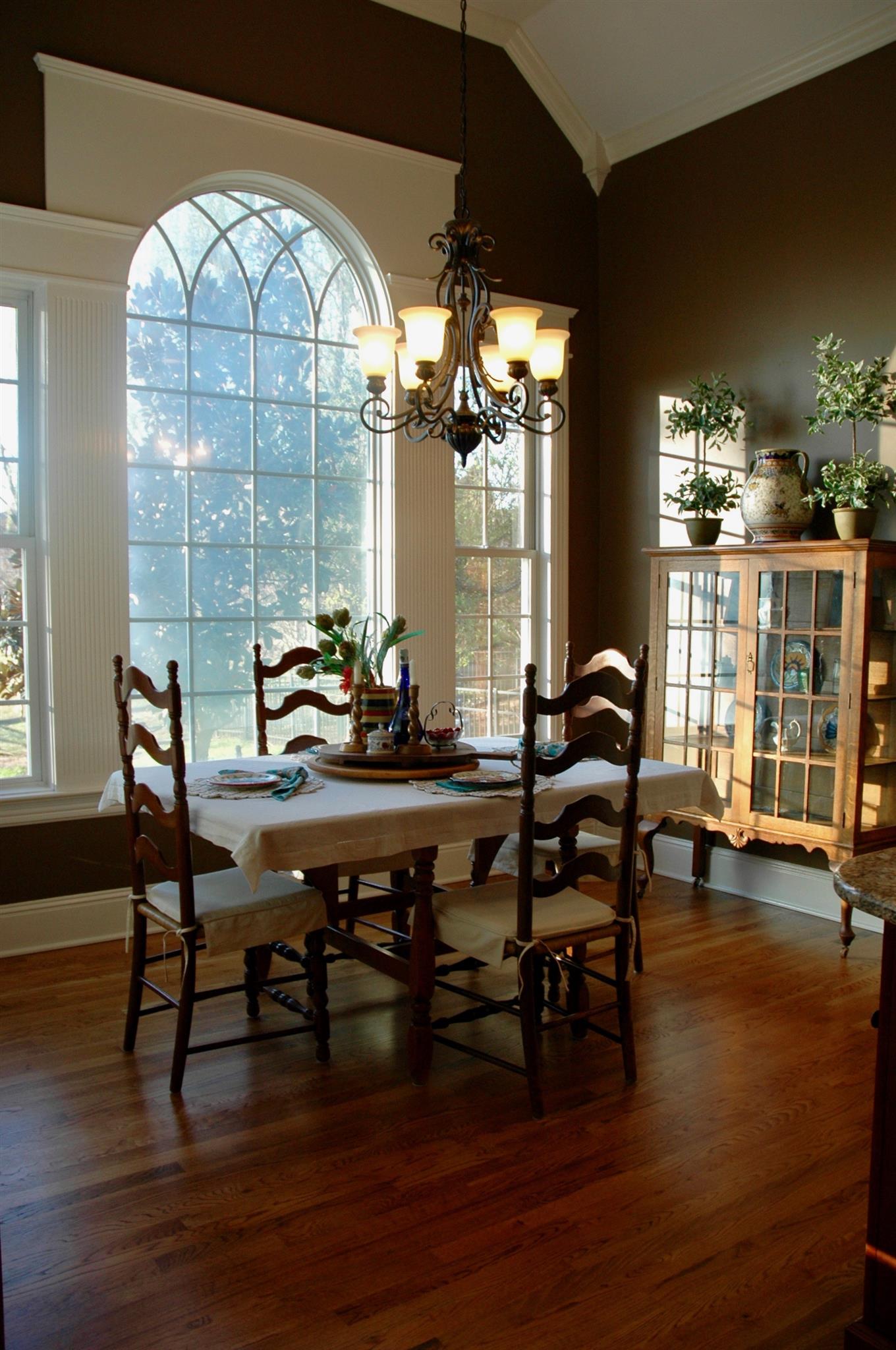 1604 Fair House Road Spring Hill, TN 37174 - Photo 4 of 18 a view of a dining room with furniture window and wooden floor