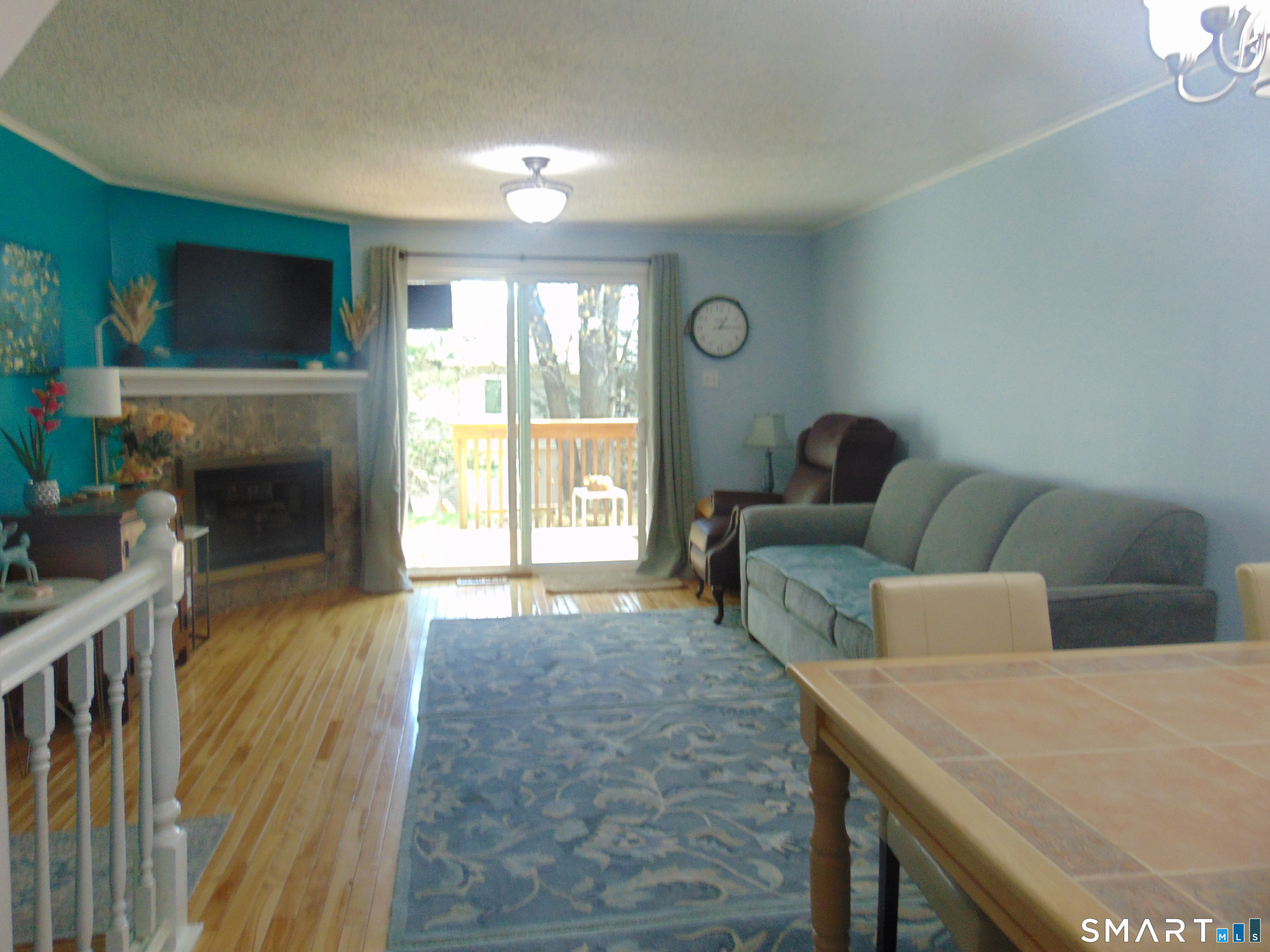 882 North Colony Road, Unit 31 Meriden, CT 06450 - Photo 9 of 34 a living room with furniture and a fireplace
