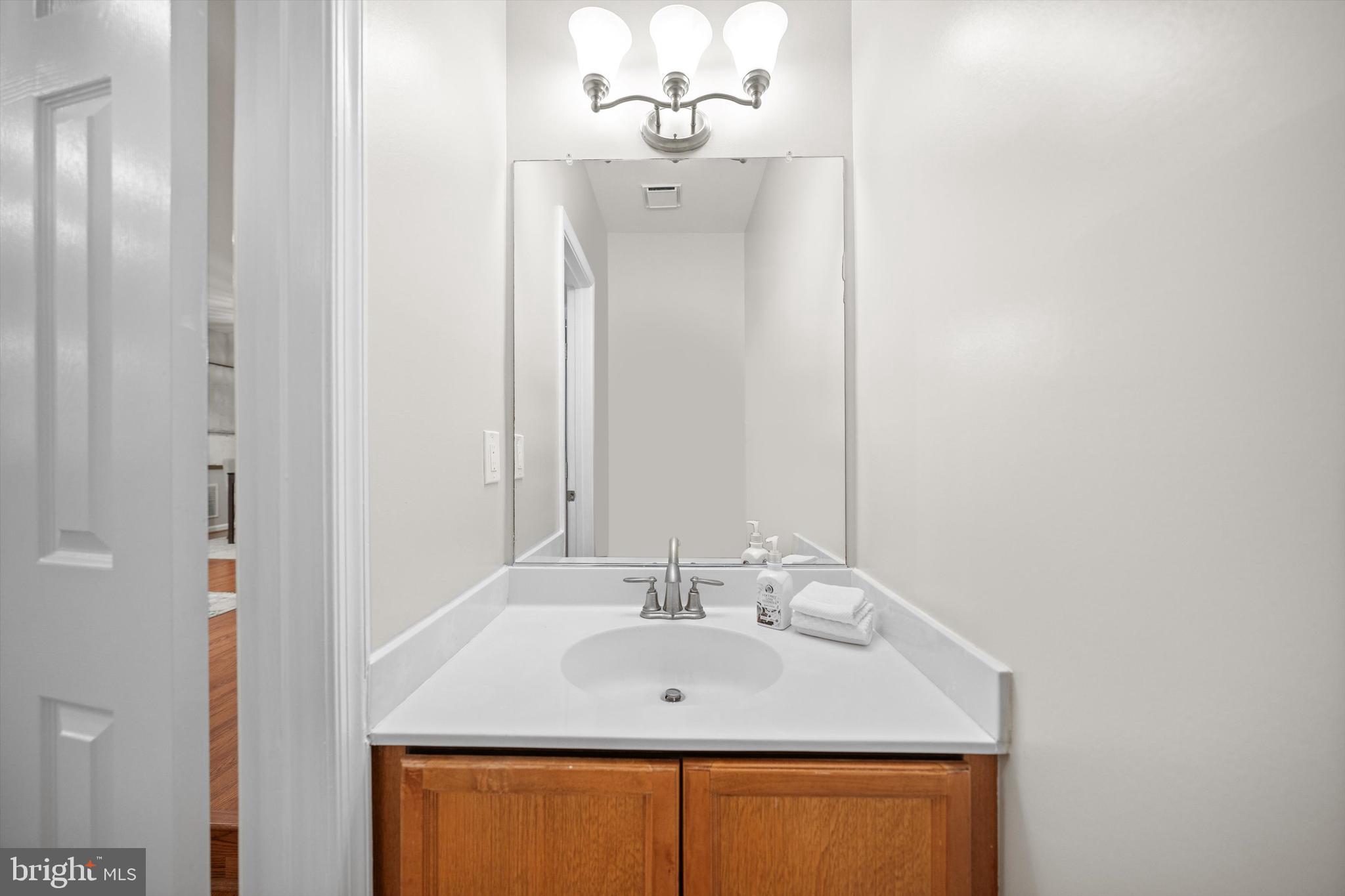8323 Ridge Crossing Lane Springfield, VA 22152 - Photo 10 of 28 Powder room on main level