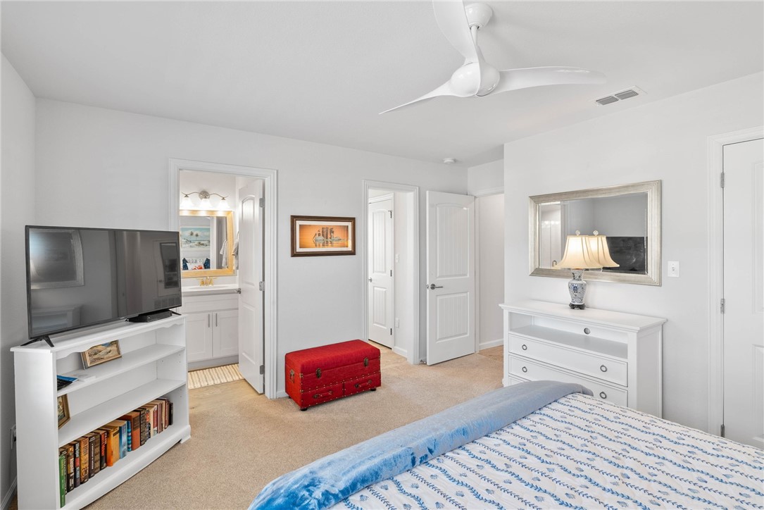 620 South Fulton Beach Road, Unit 611 Rockport, TX 78382 - Photo 12 of 15 a bedroom with a bed and a flat screen tv