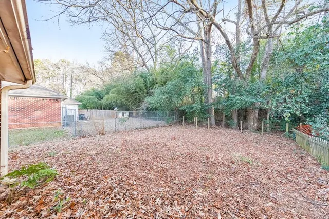 a backyard of a house with lots of green space