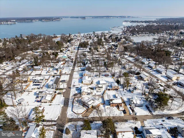 an aerial view of a city with ocean view