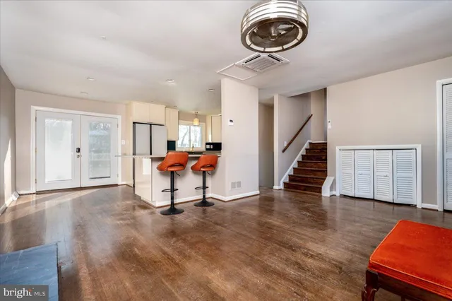a living room with furniture and a rug