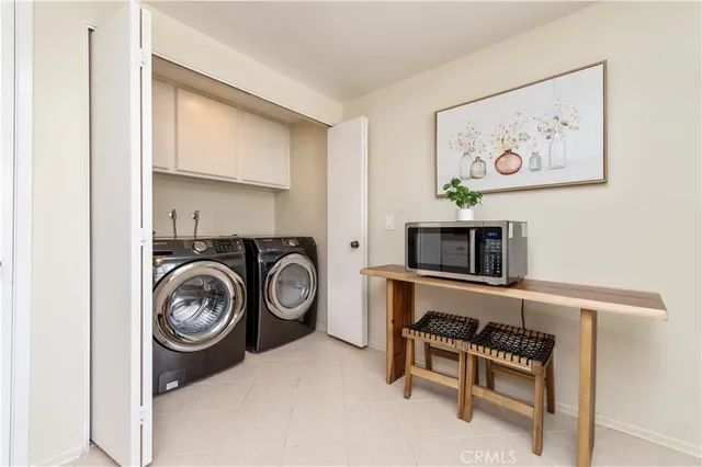 a view of a storage & utility room with washer and dryer