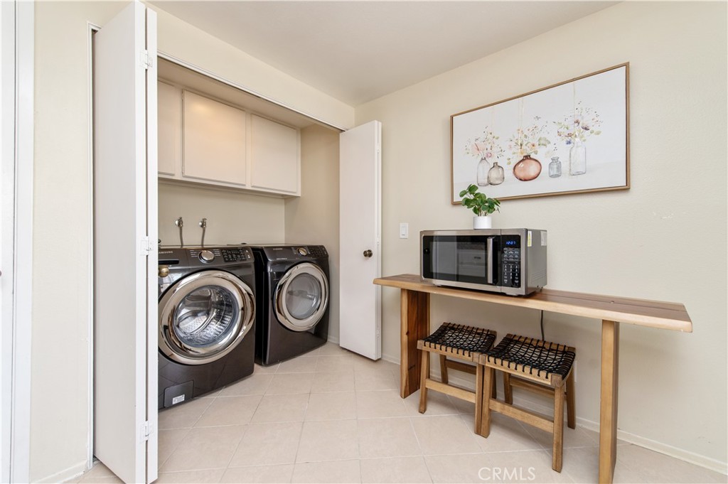9 Morena, Unit 28 Irvine, CA 92612 - Photo 14 of 27 a view of a storage & utility room with washer and dryer