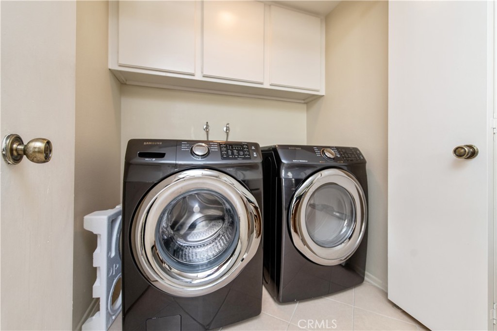 9 Morena, Unit 28 Irvine, CA 92612 - Photo 15 of 27 a utility room with dryer and washer